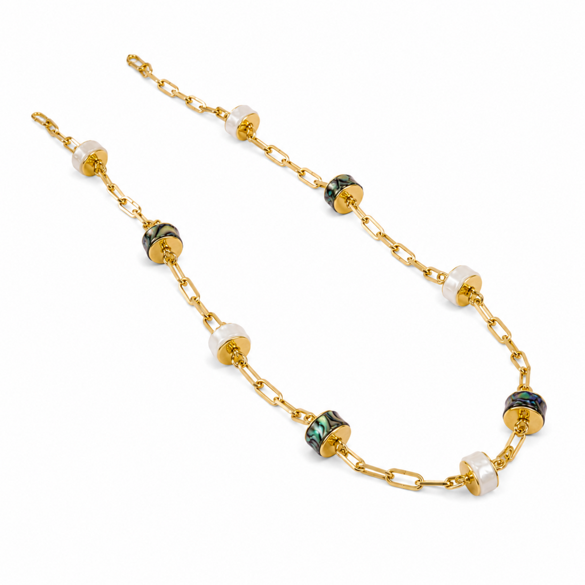 A gold chain necklace featuring alternating round white shell beads and dark green and black inlay beads, displayed on a clean white background.