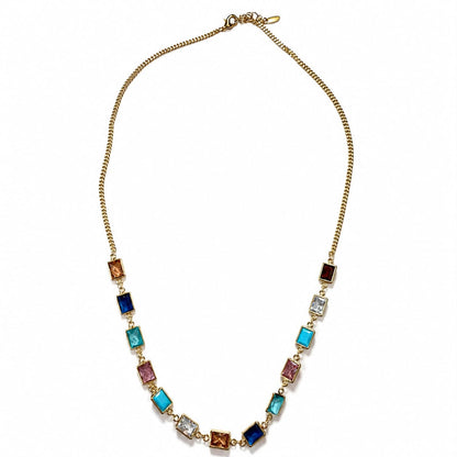 A gold chain necklace featuring a series of colorful rectangular glass beads in shades of blue, turquoise, pink, purple, and brown, displayed on a clean white background.